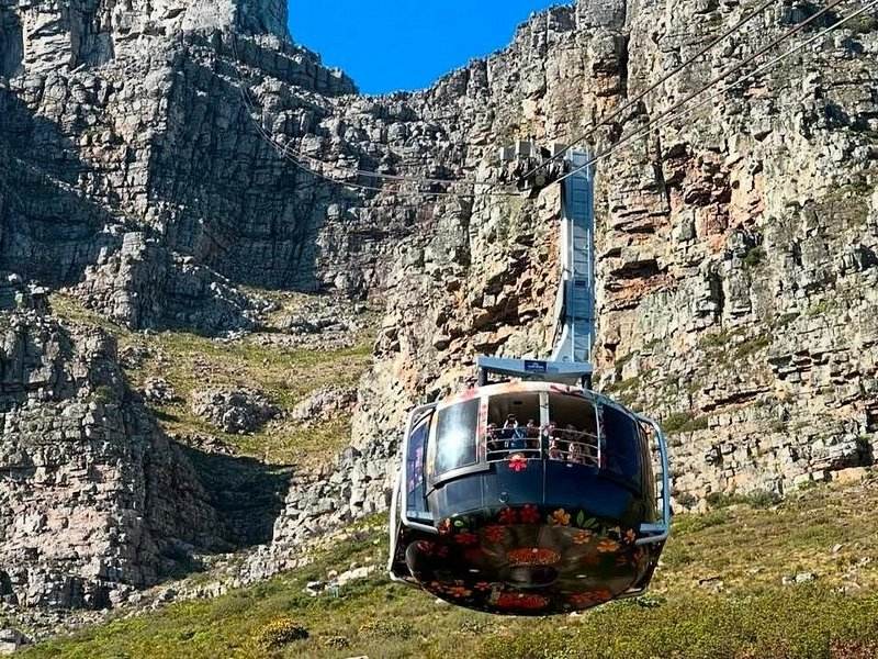 A Table Mountain Aerial Cableway car climbing the face of the mountain